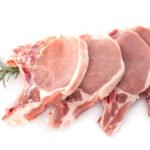 pork chops in front of white background