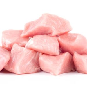 pork uncookes chopped cubes close up isolated on white background